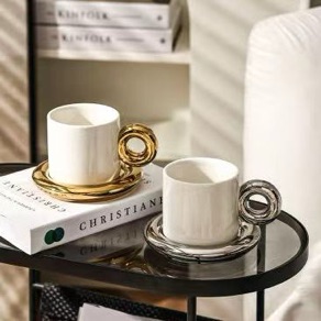 Black and white ring-handle cups